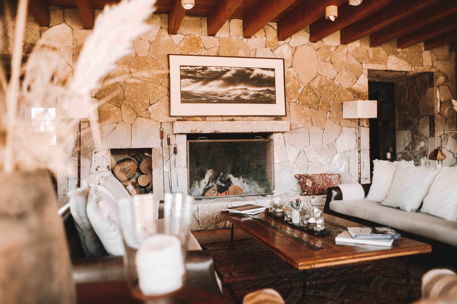 The living room with its stone fireplace