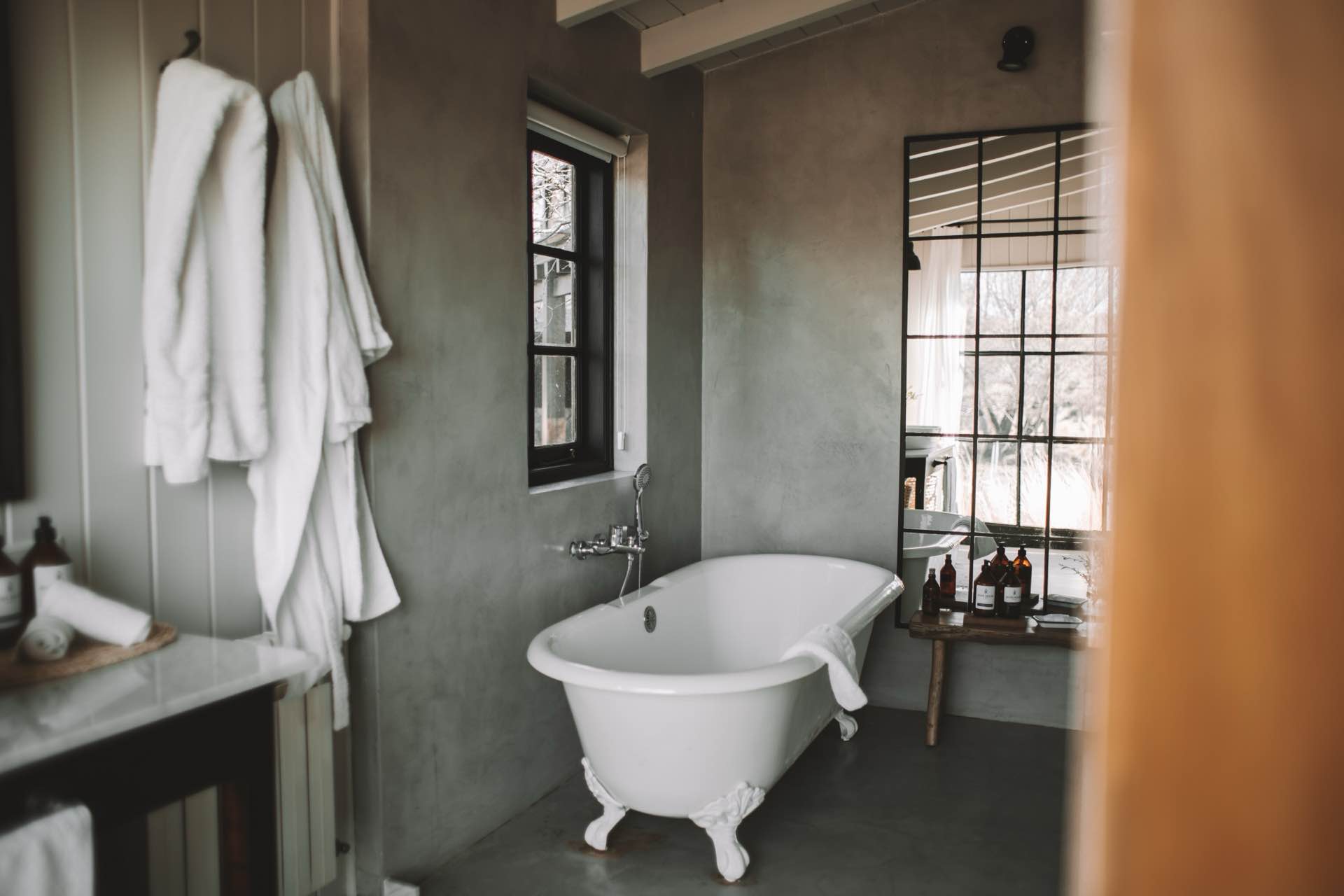 A bathroom with a freestanding bathtub