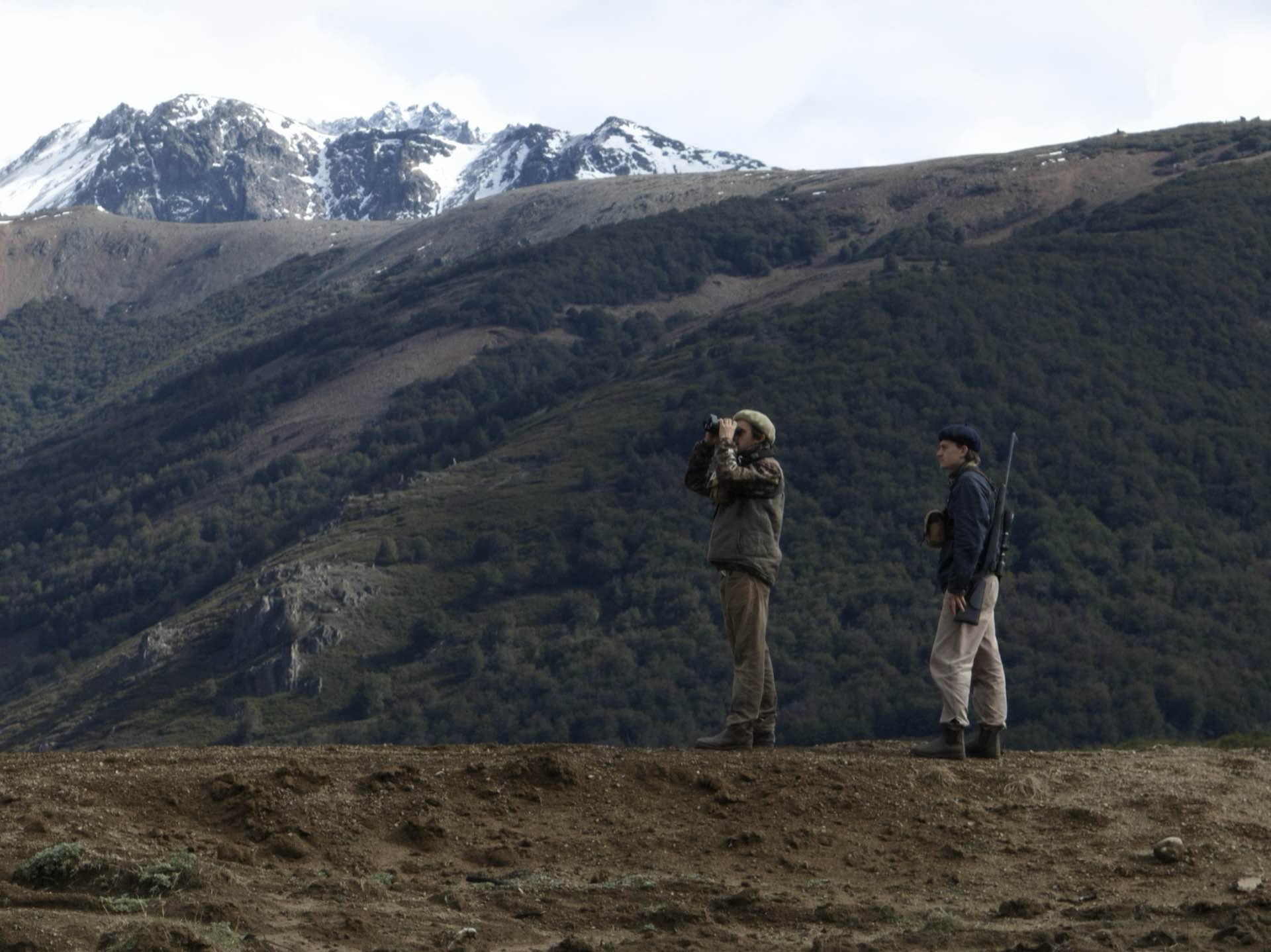 Hunters glassing the mountains with binoculars