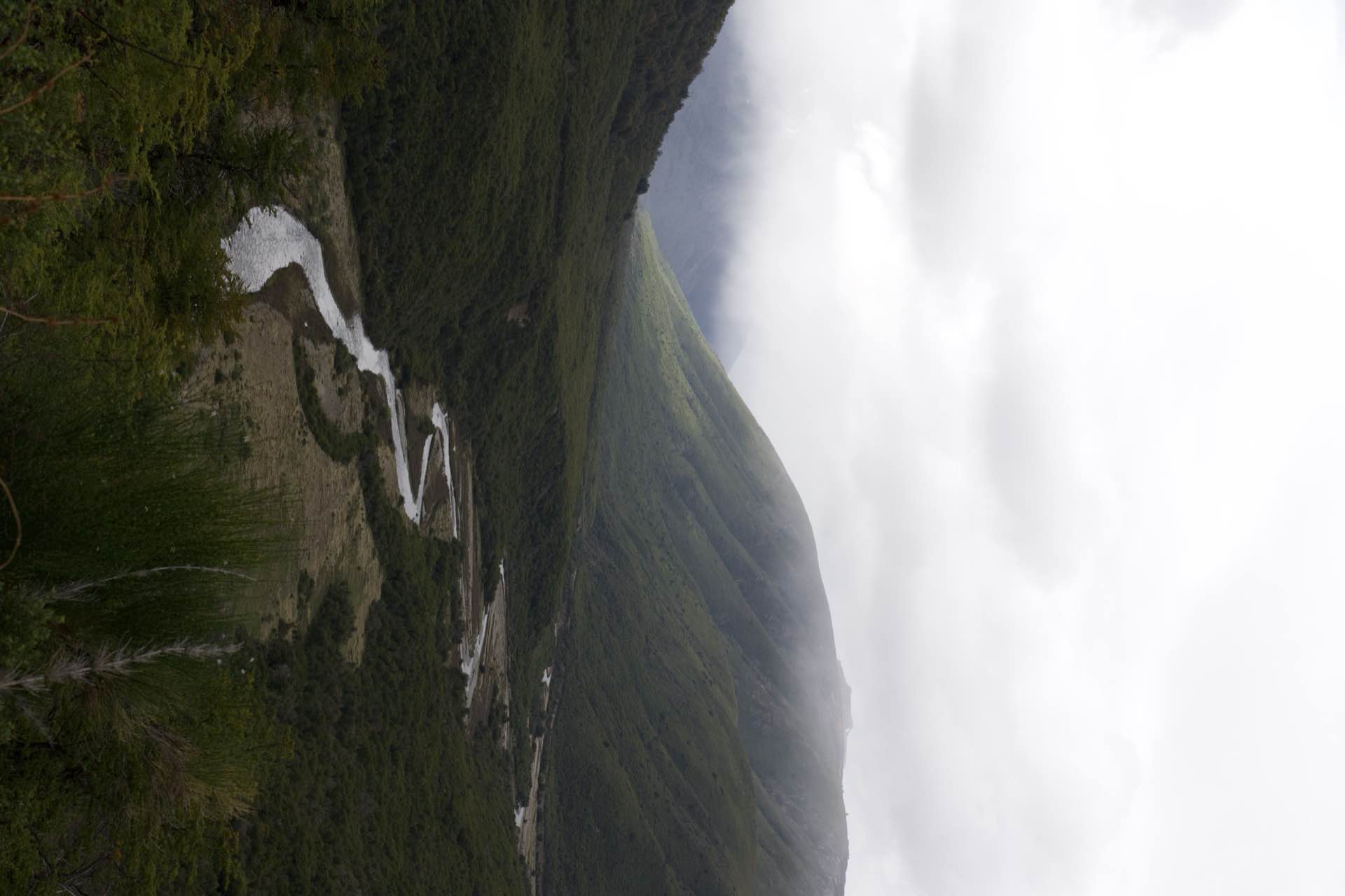 A river winding through a misty valley